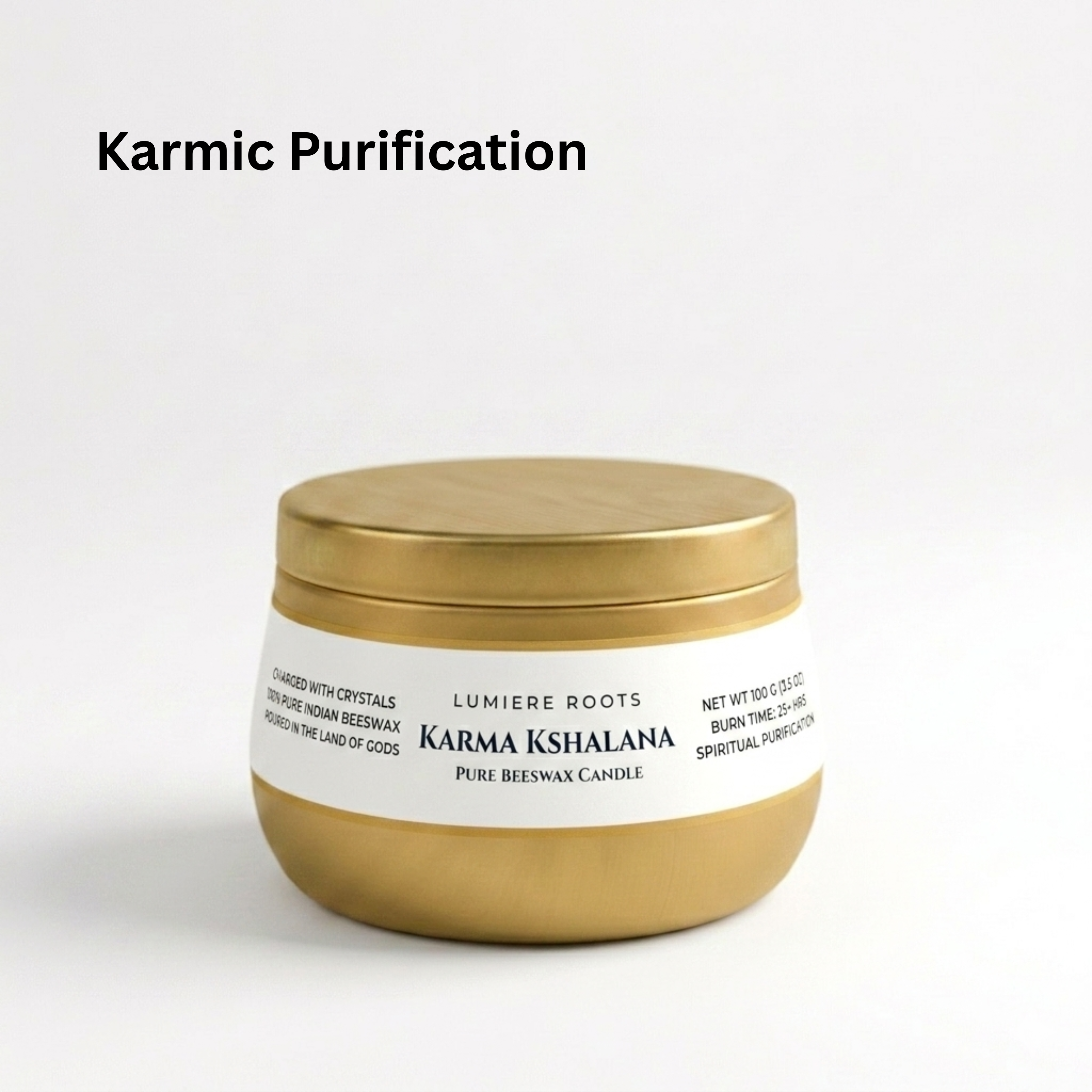 Gold candle jar with white label on a light gray background, featuring the brand 'Karma Kshalana'. - karmic purification beeswax candle